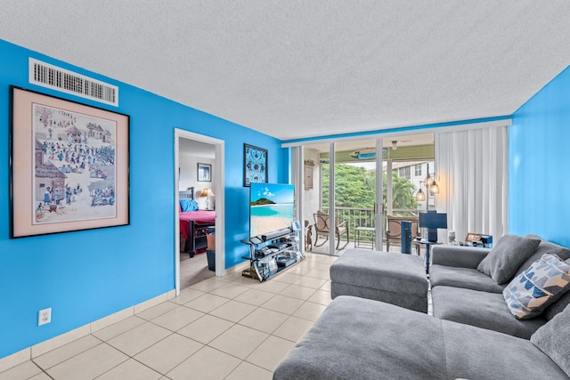 tiled living room with a textured ceiling