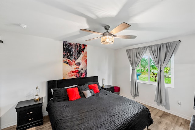 bedroom featuring light hardwood / wood-style floors and ceiling fan