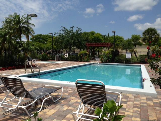 view of swimming pool featuring a patio area