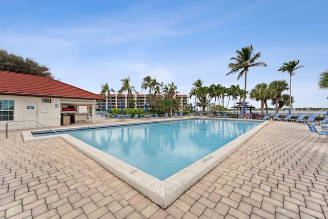 community pool featuring a patio area