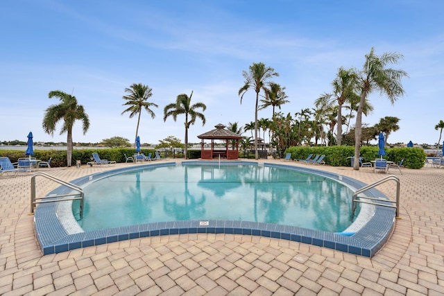 pool featuring a patio and a gazebo