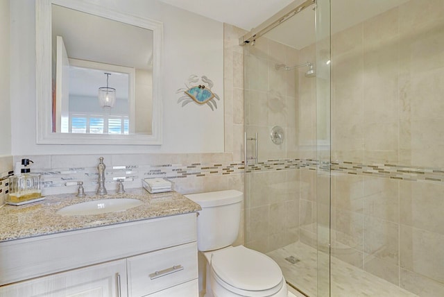 bathroom featuring vanity, toilet, tile walls, tasteful backsplash, and an enclosed shower