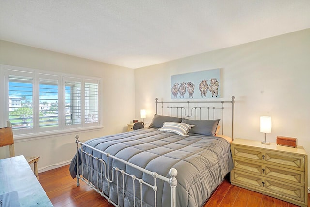 bedroom featuring wood-type flooring