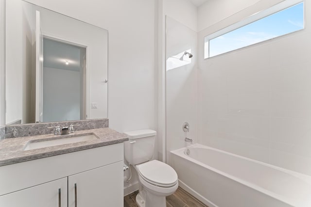 full bathroom with shower / tub combination, hardwood / wood-style floors, vanity, and toilet