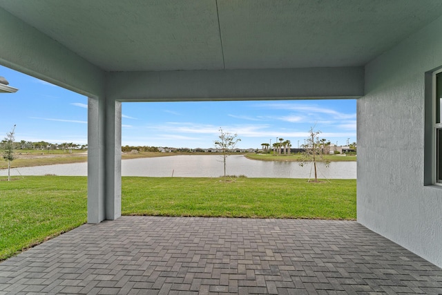 view of patio with a water view