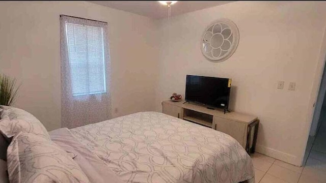 bedroom with light tile patterned flooring