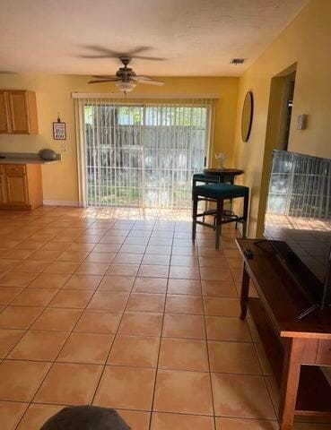 interior space featuring ceiling fan