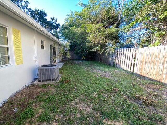 view of yard with central AC unit