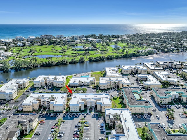 birds eye view of property with a water view