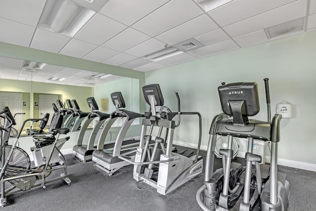 exercise room with a drop ceiling