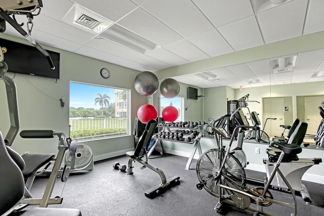 exercise room featuring a drop ceiling