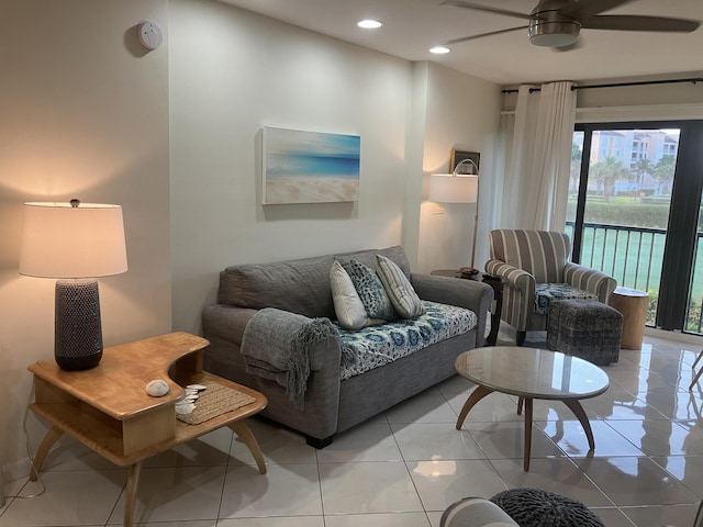 living room with ceiling fan and light tile patterned floors