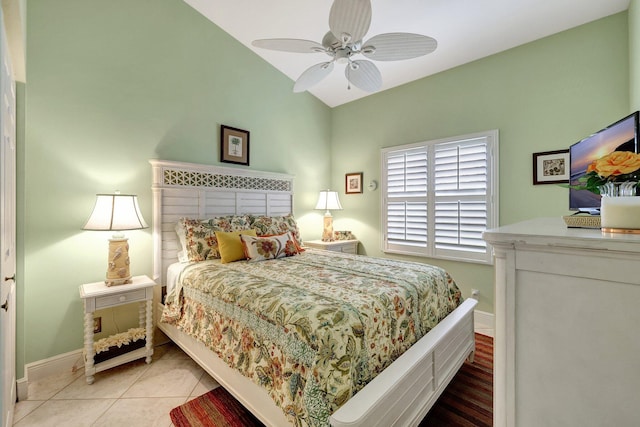 tiled bedroom with ceiling fan