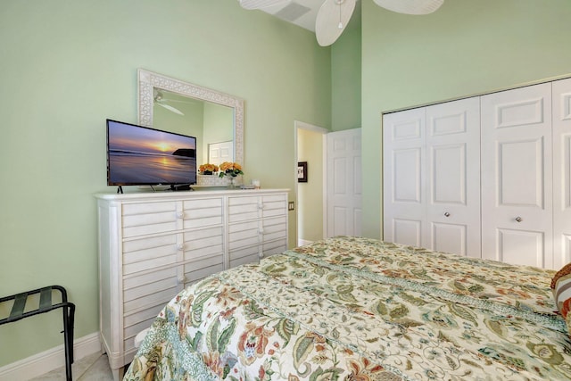 bedroom with ceiling fan and a closet