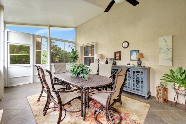 dining area with ceiling fan and lofted ceiling