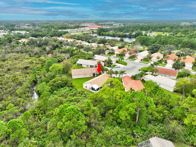 birds eye view of property with a water view