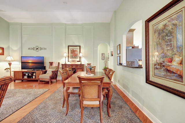 dining area with hardwood / wood-style flooring