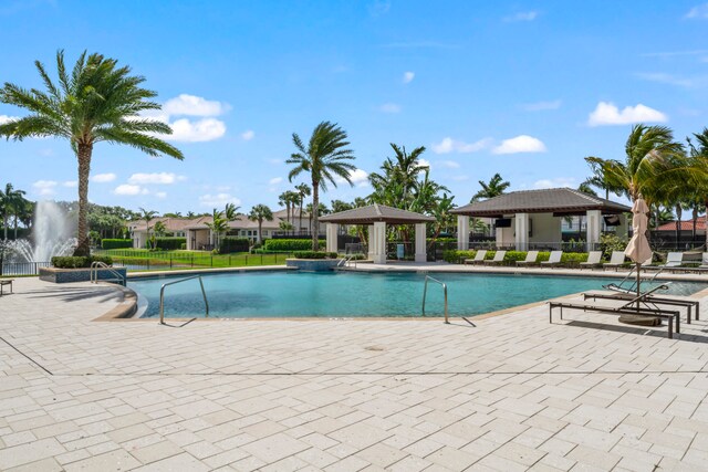 view of swimming pool with a gazebo and a patio area