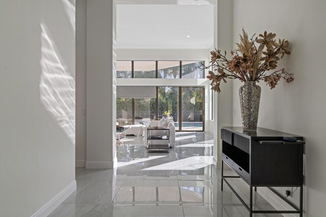 foyer featuring crown molding