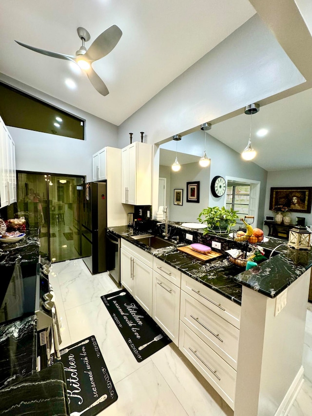 kitchen with ceiling fan, sink, stainless steel dishwasher, kitchen peninsula, and decorative light fixtures