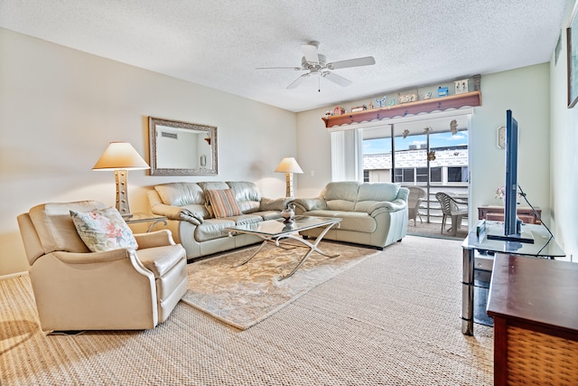 carpeted living room featuring a textured ceiling and ceiling fan