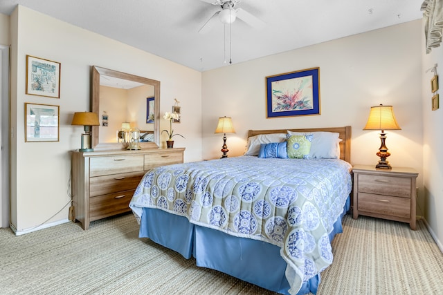 bedroom featuring ceiling fan and light carpet