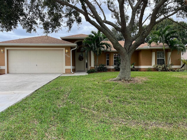 ranch-style house with a front yard and a garage