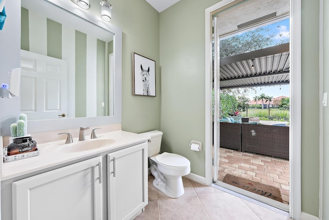 bathroom with vanity, tile patterned floors, and toilet