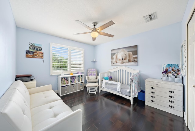 bedroom featuring dark hardwood / wood-style flooring and ceiling fan