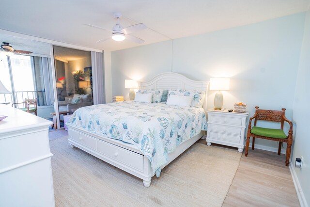 bedroom with ceiling fan and light hardwood / wood-style floors