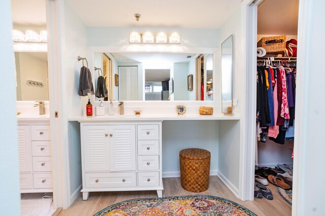 bathroom featuring vanity and wood-type flooring