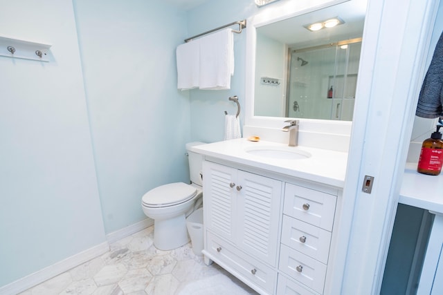 bathroom with vanity, toilet, and an enclosed shower