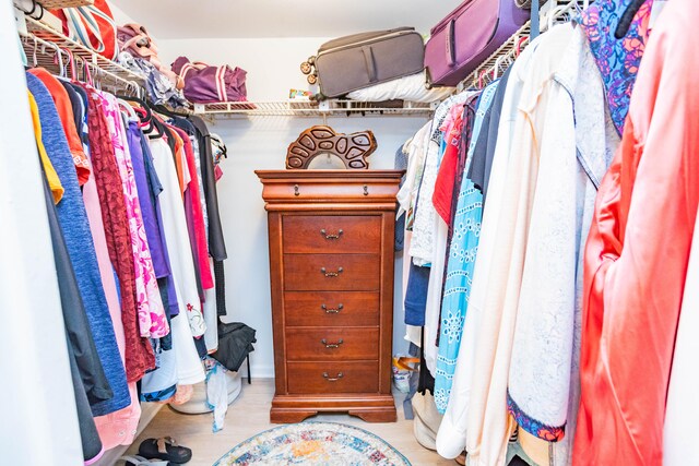 walk in closet featuring light hardwood / wood-style floors