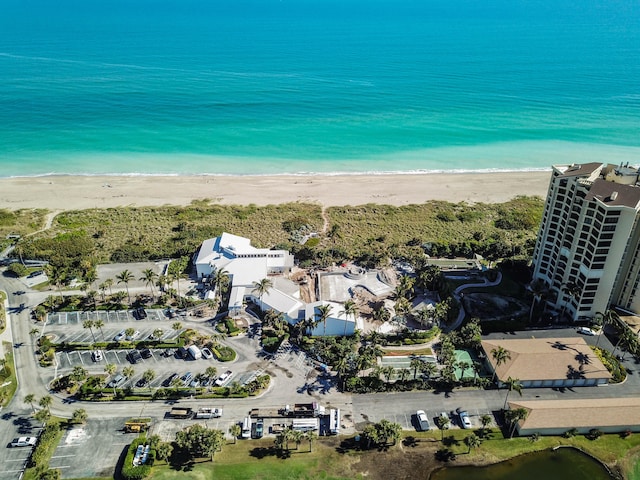 aerial view featuring a water view and a beach view