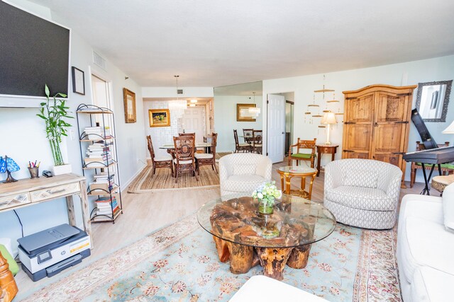 living room with light hardwood / wood-style flooring