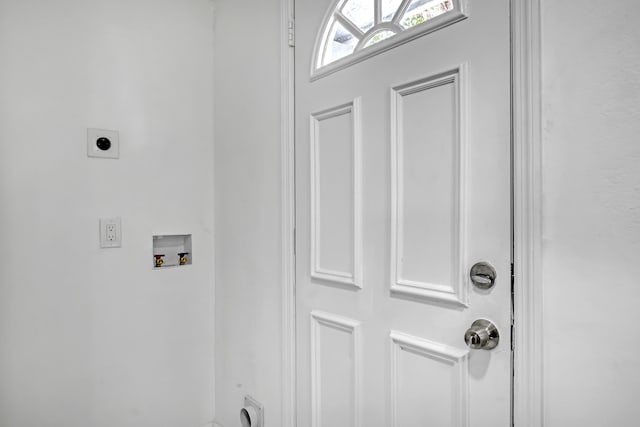 clothes washing area featuring electric dryer hookup and washer hookup