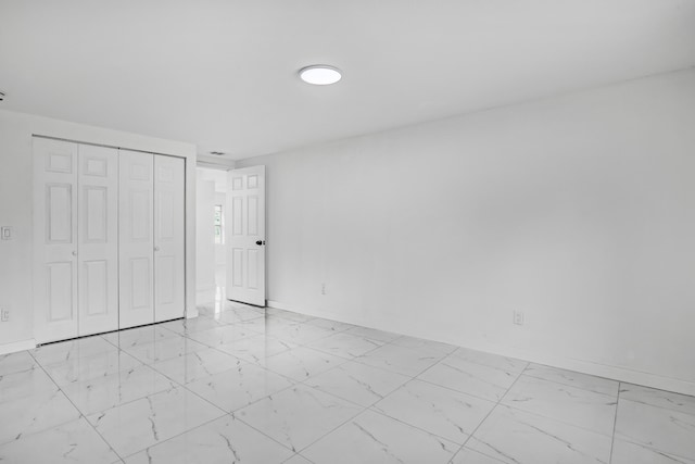 unfurnished bedroom featuring a closet