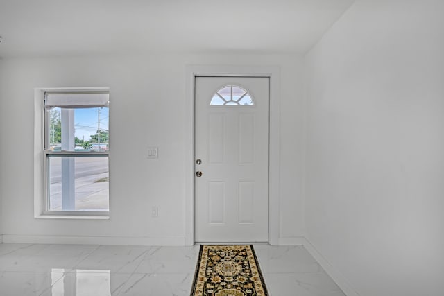 foyer featuring plenty of natural light