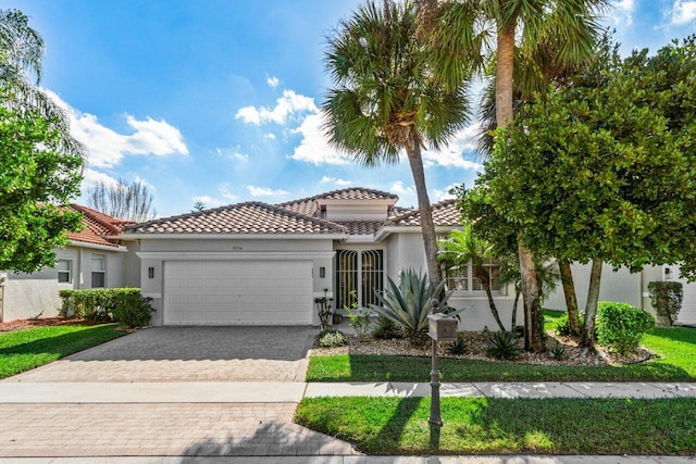 mediterranean / spanish house featuring a garage