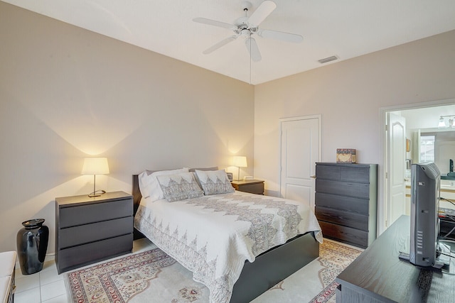 tiled bedroom featuring ceiling fan