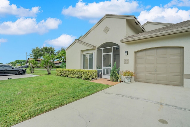 view of front of house featuring a garage and a front yard