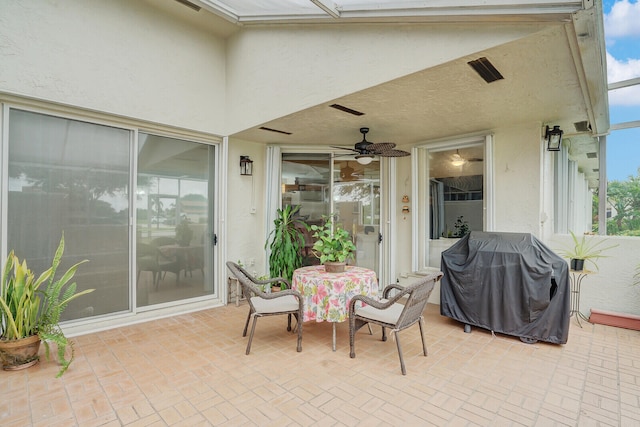 view of patio / terrace featuring a grill, a lanai, and ceiling fan