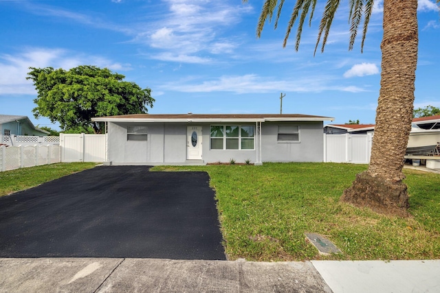 ranch-style home with a front yard