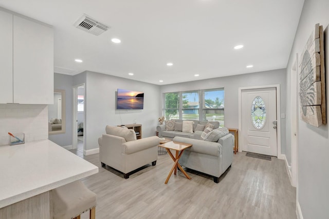 living room with light hardwood / wood-style floors