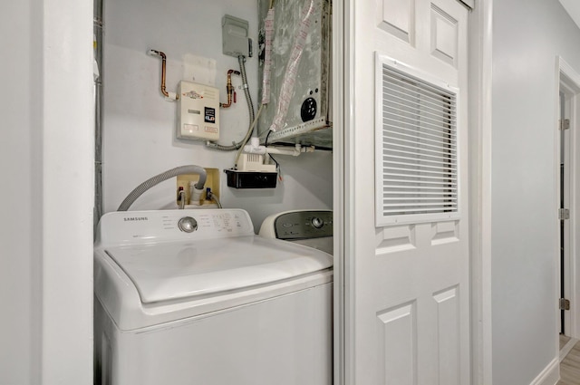 laundry area with washing machine and clothes dryer