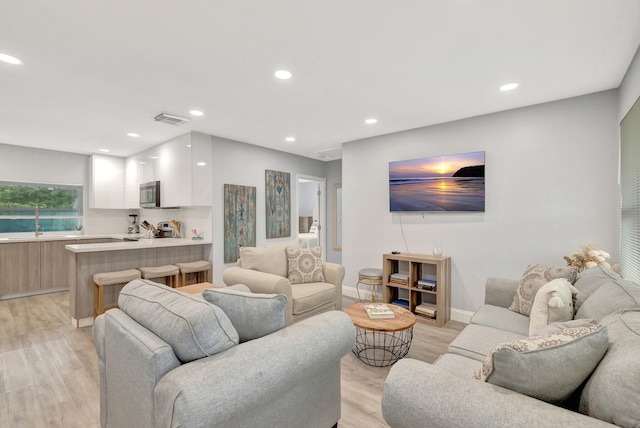 living room featuring light wood-type flooring