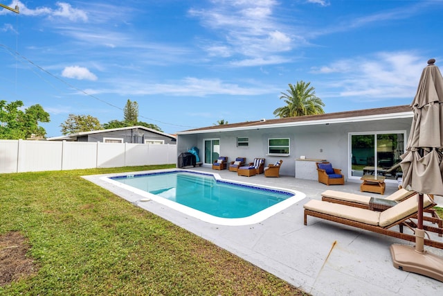 view of pool featuring a lawn, a patio area, and an outdoor hangout area