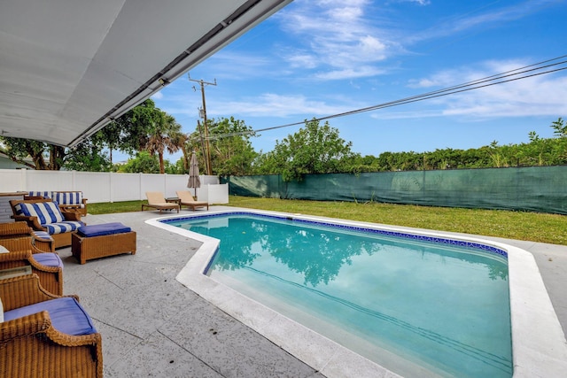 view of swimming pool featuring an outdoor living space and a patio