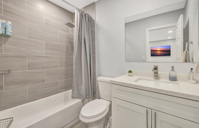 full bathroom featuring shower / tub combo with curtain, vanity, and toilet