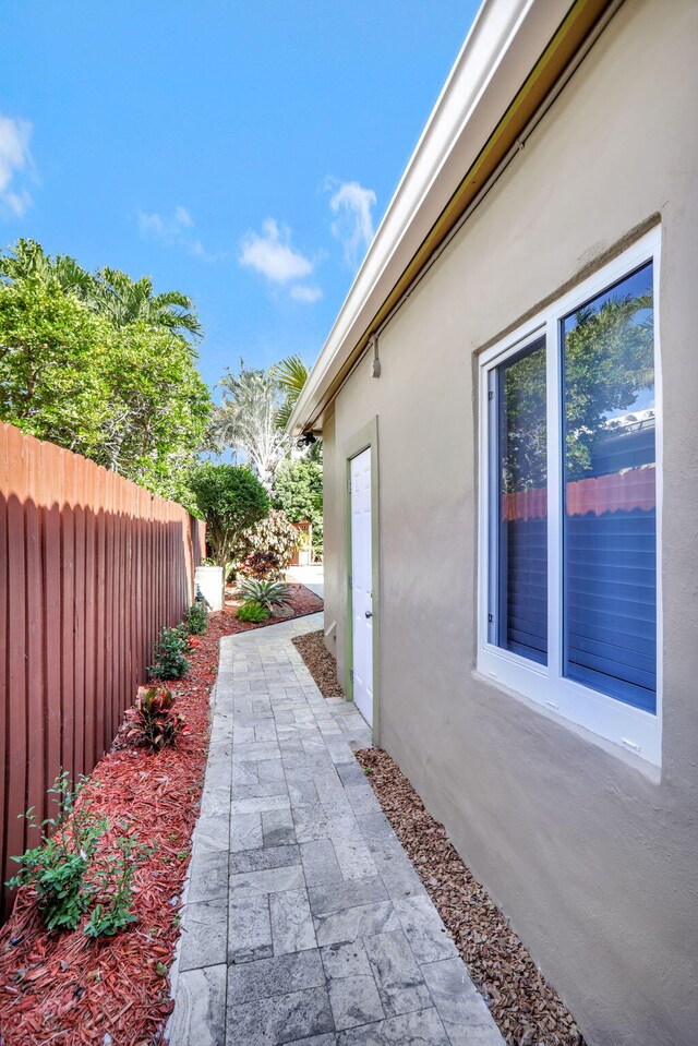 view of side of property featuring a patio area